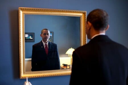 Barack Obama looking into mirror before inauguration