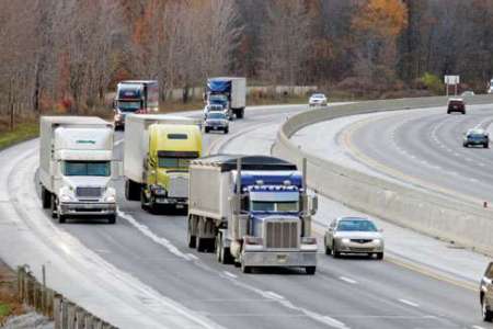 Semi Trucks on highway with other traffic