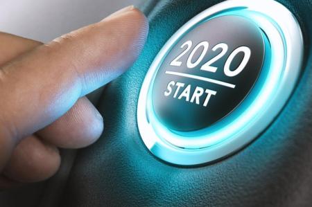 2020 Start button being pressed to start the new year